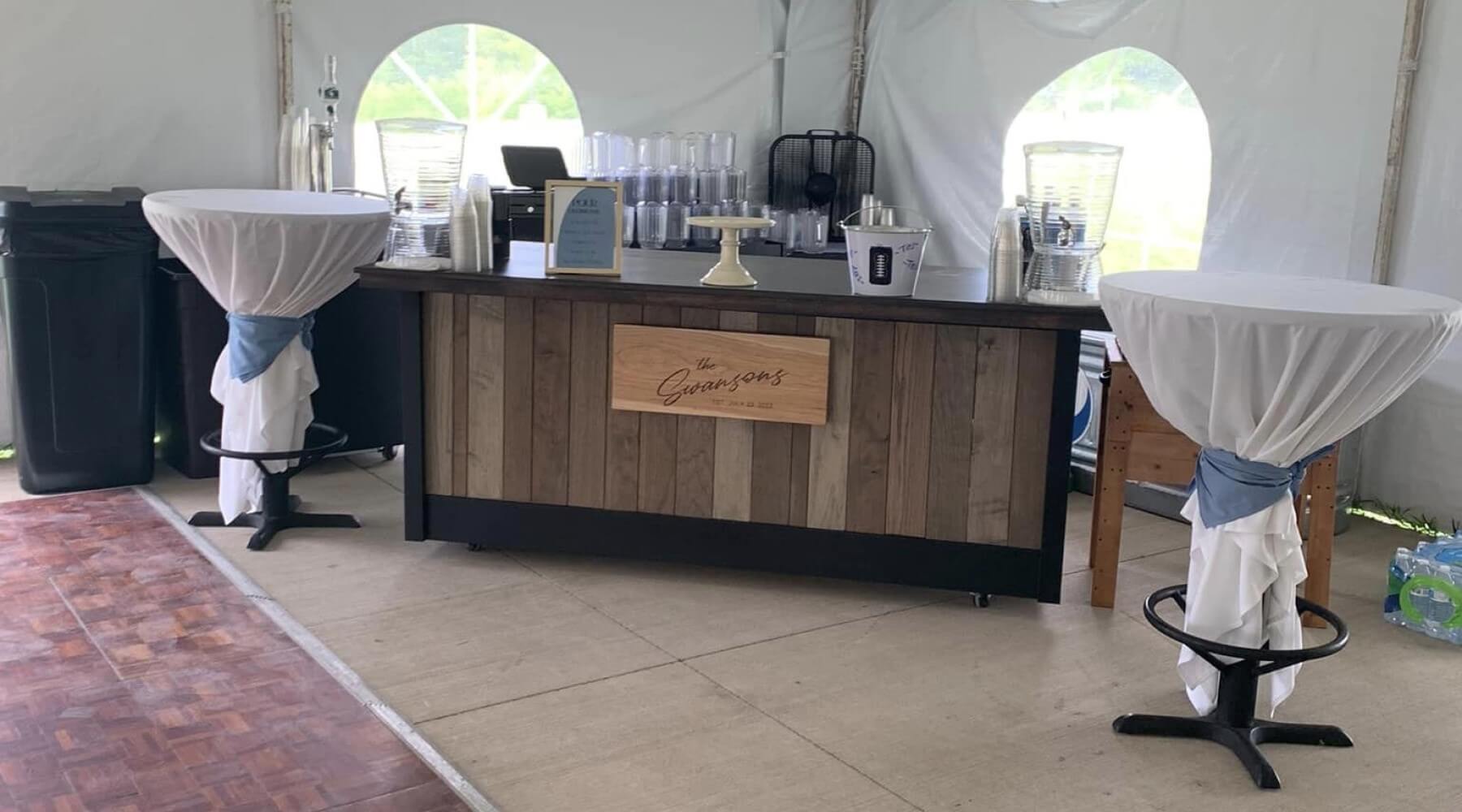 A pop-up style bar in a wedding tent